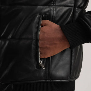Men's black leather bomber jacket detail